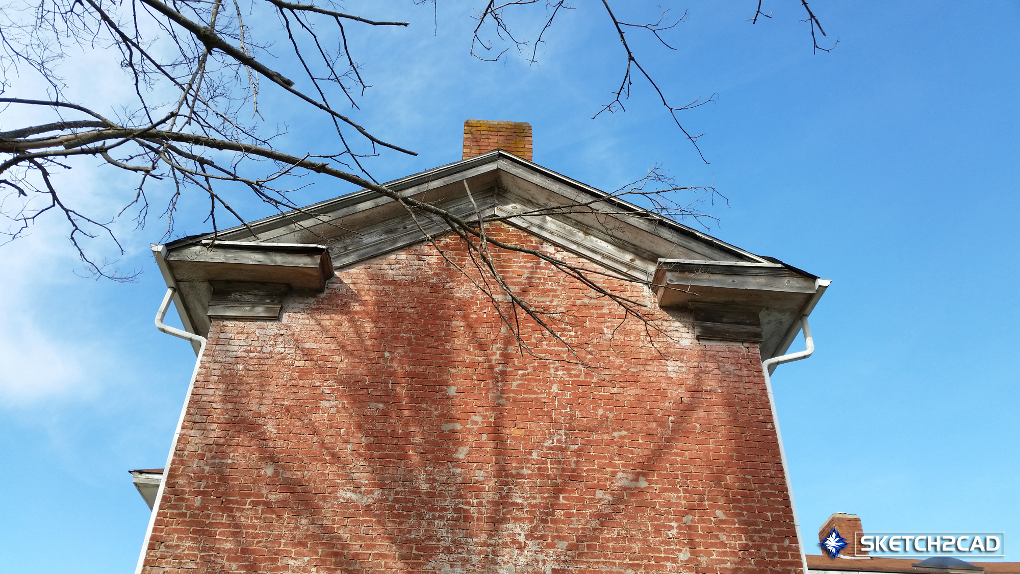 Photograph of of the Kirby-McMillian home ornamental wood trim and greek returns on the roof.