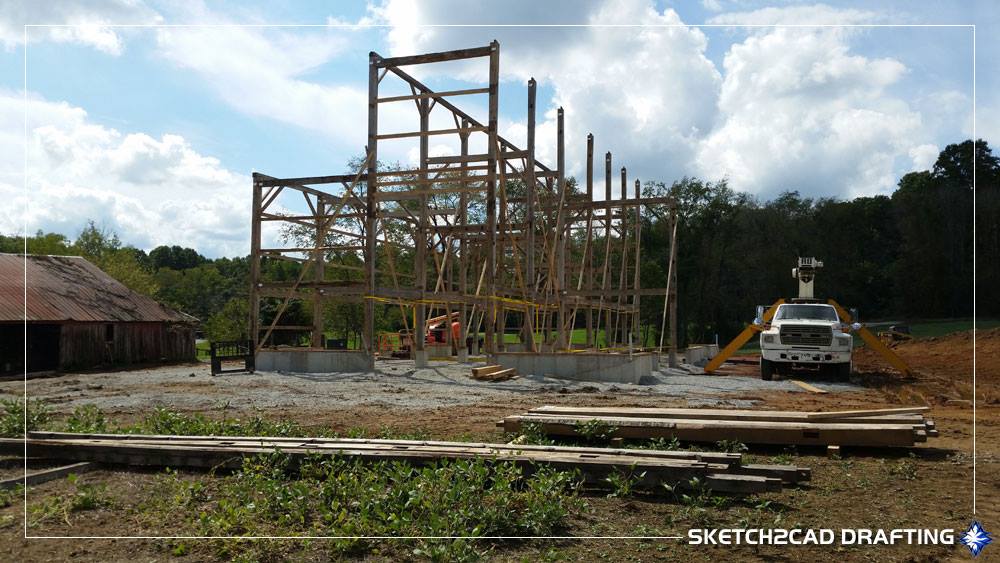 Barn raising at the historic wood barn structure at the Whippoorwill Hill wedding event barn project located in Bloomington, Indiana