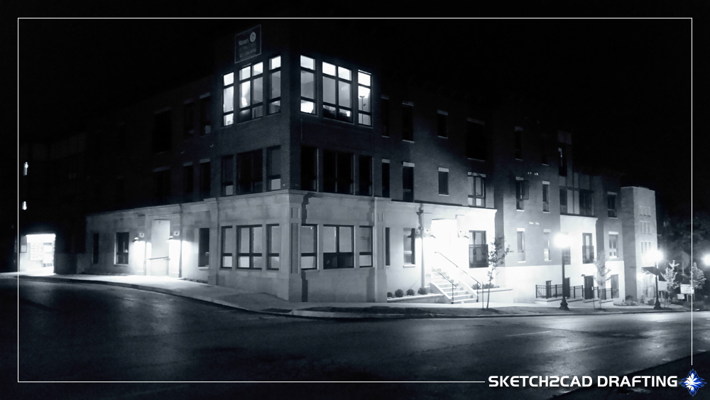 Photograph at night of the Manors at the Crest apartments located in Bloomington, Indiana
