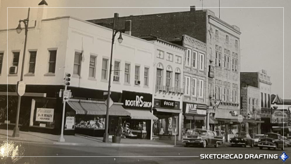 1960 fifth and walnut street intersection looking south down Walnut Street in Bloomington, Indiana showing R&S Boot Shop, The Vogue Clothing Company, Wylie Furniture. and Hall Electric Company has vacated the corner space