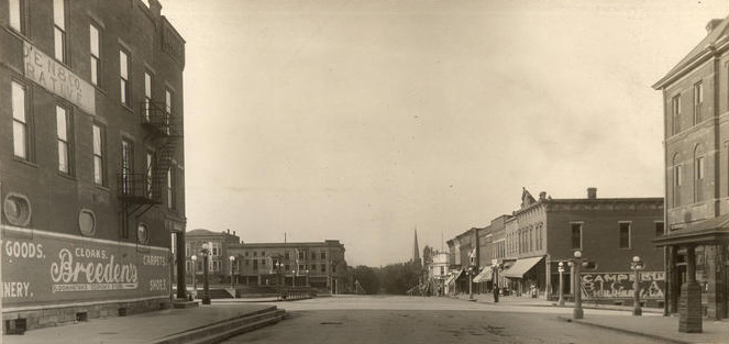 1907_college_ave_south_bloomington_IU_archives_lights 1907 college avenue looking south on the courthouse square in bloomington indiana showing downtown buildings with lights on the courthouse area