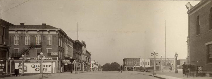 1907_fifth_street_west_bloomington_indiana_IU_archives_lights 1907 sixth street looking west on the courthouse square in bloomington indiana showing downtown buildings with lights at the courthouse area
